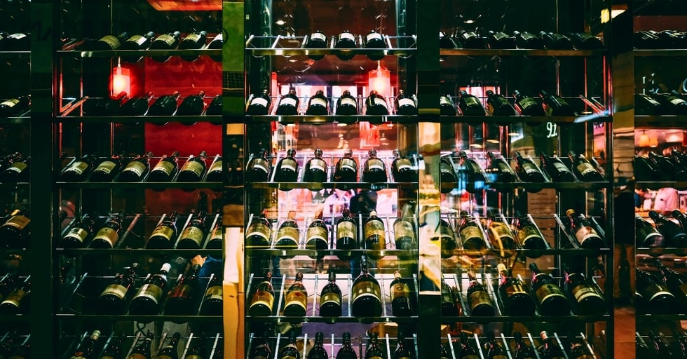 Well-stocked wine storage display in a restaurant, showing the role of safety stock in maintaining product availability for guests.