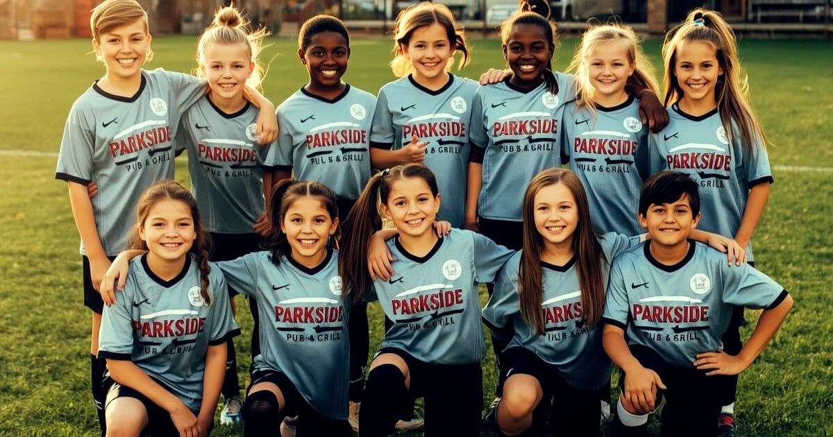 Youth soccer team posing for a group photo in jerseys sponsored by a local restaurant.