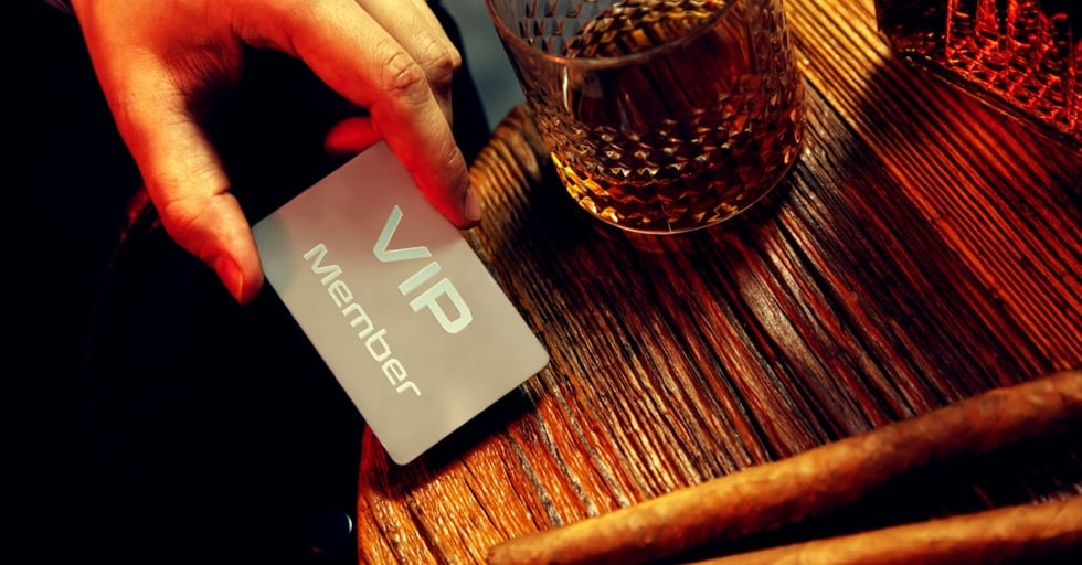 VIP access card on a table — customer loyalty reward for frequent guests.