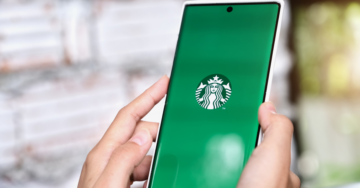 Starbucks Rewards loyalty program app on smartphone screen, example of restaurant loyalty programs that boost customer retention