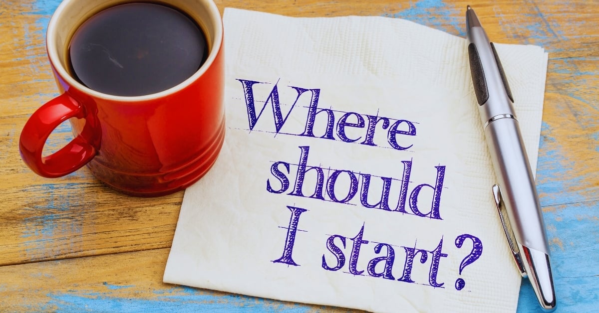 Red coffee mug and silver pen beside a napkin that reads “Where should I start?” — symbolizing the first step toward improving restaurant operations.