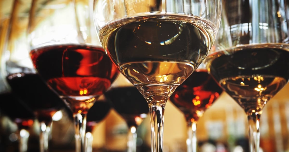 Close-up of glasses of red and white wine showing standard pour levels.