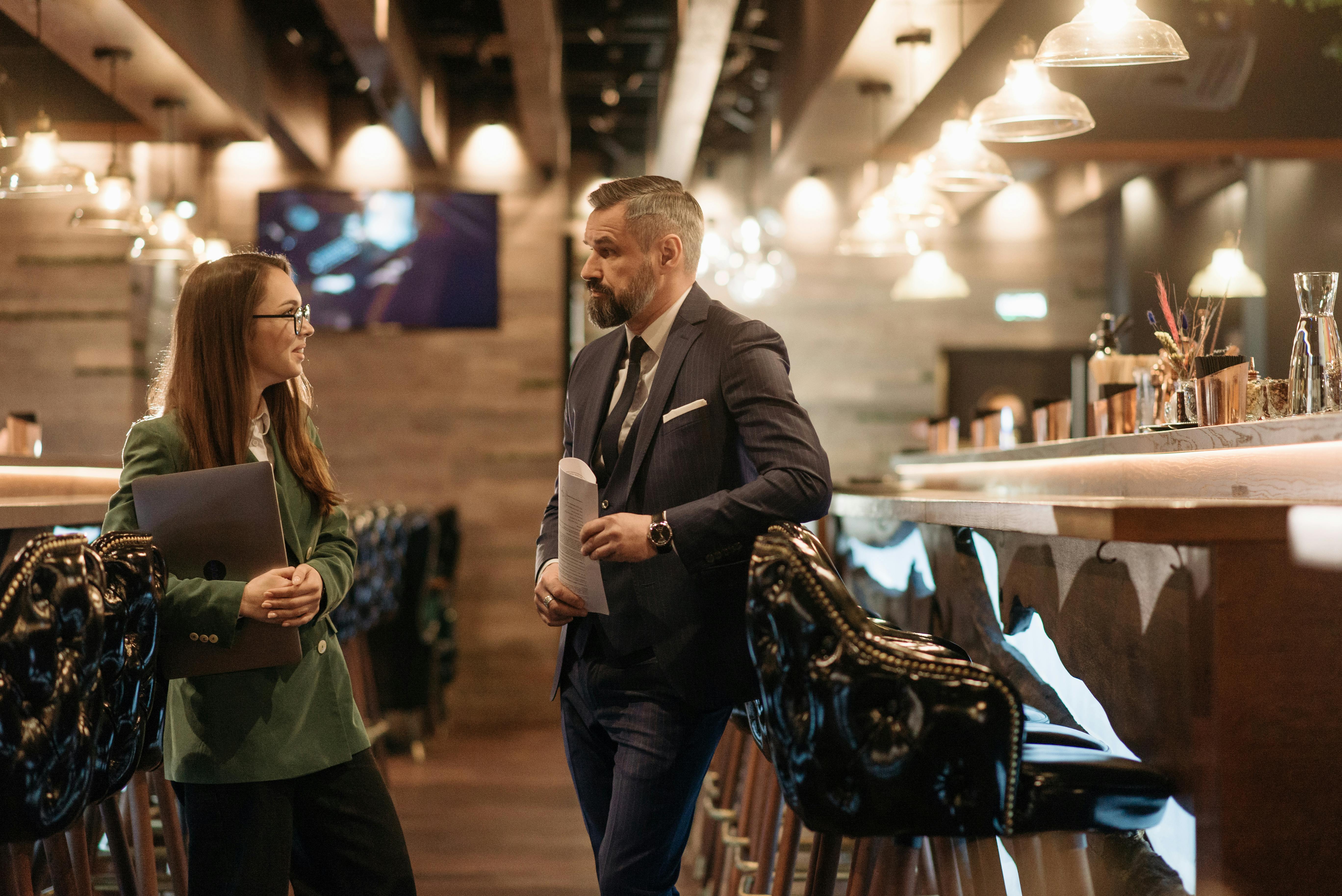 Image of bar owner talking to a hospitality consultant