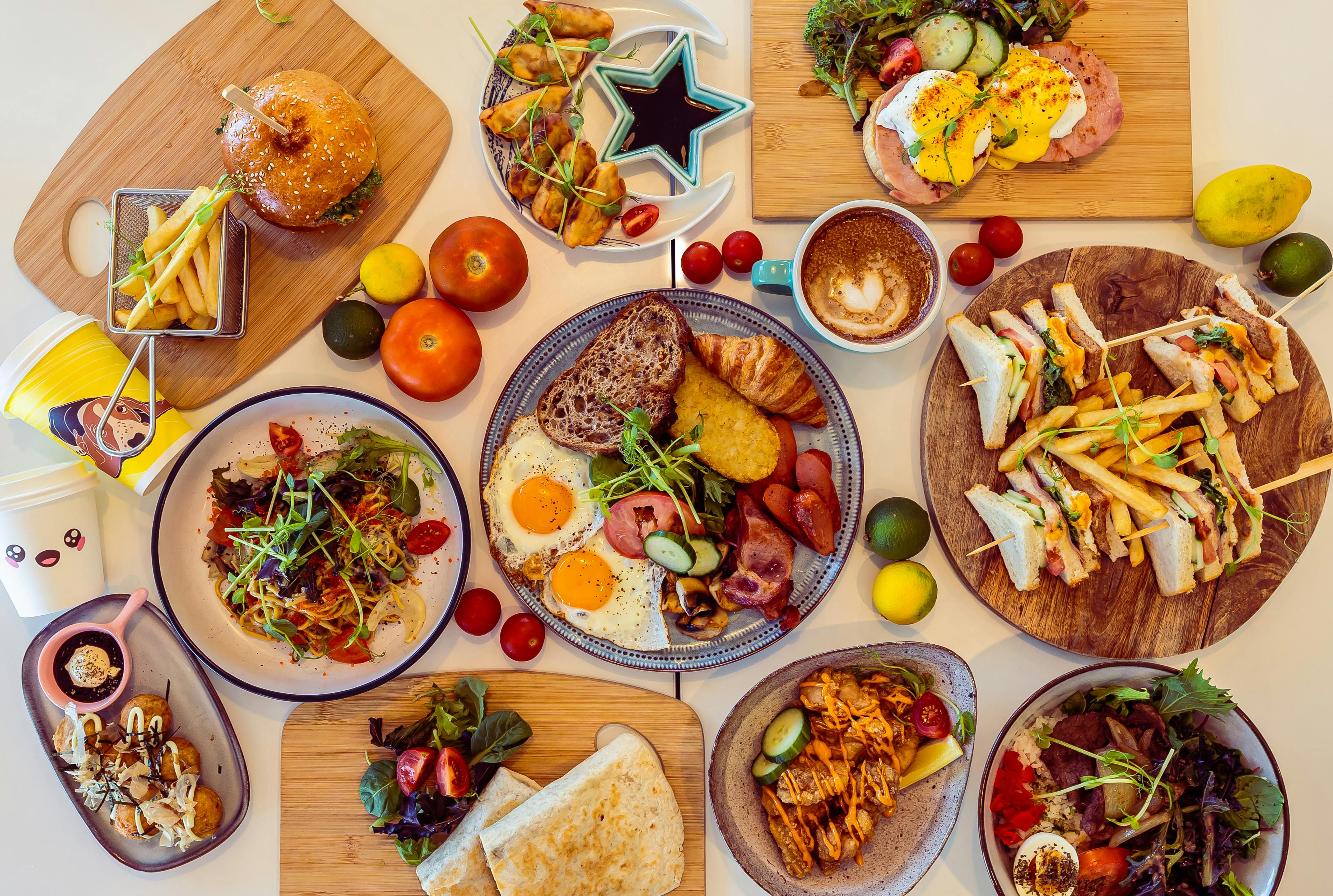 Full restaurant menu spread featuring burgers, sandwiches, breakfast plates, fries, salads, and plated entrées — illustrating menu variety for menu engineering and food cost control.